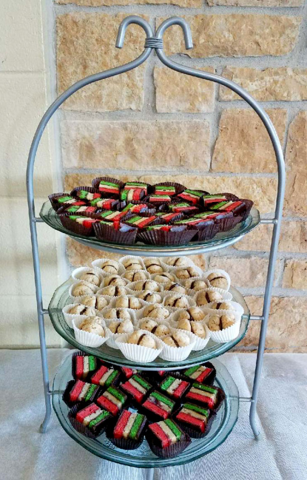 Three-tiered cookie tray has rainbow cookies and Lady Kisses - both with chocolate