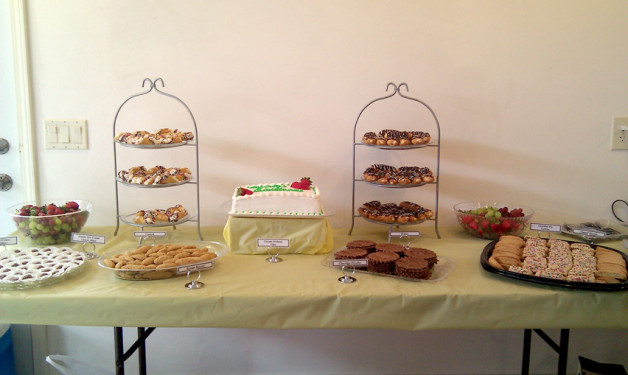 Full table of Italian Sweets - eclairs, cannoli, cookies, mints, cake - the works!