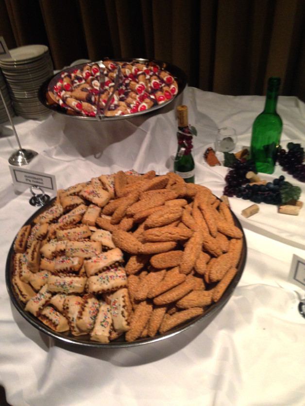 cannoli cuccidate and sesame biscotti on the sweets table